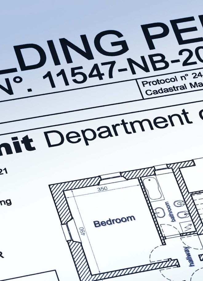 Building permit paperwork and architectural drawings